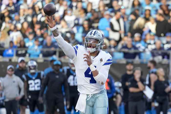 Nov 19, 2023; Charlotte, North Carolina, USA; Dallas Cowboys quarterback Dak Prescott (4) makes a throw against the Carolina Panthers during the second half at Bank of America Stadium.